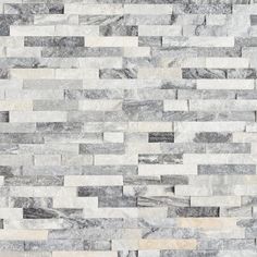 a white and grey tile wall with different colors