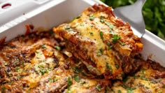 lasagna casserole with meat and cheese in a white dish