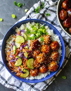 teriyaki chicken meatballs with rice and vegetables in a blue bowl