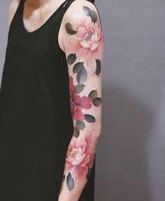 a woman with flowers painted on her arm