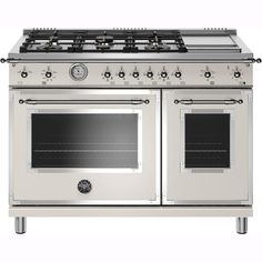 a white stove top oven with two burners and one door on the front side