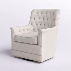 an upholstered white chair with buttons on the back and armrests is shown