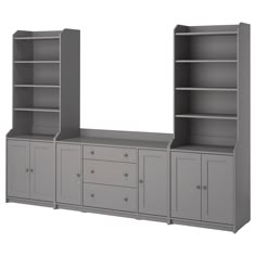 a gray bookcase with drawers and cupboards