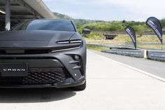 the front end of a gray sports car