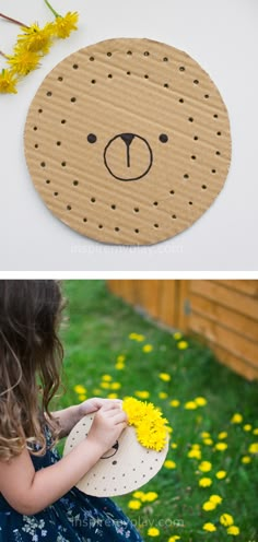 a girl is holding a paper plate with a bear face on it, and the other side has yellow flowers