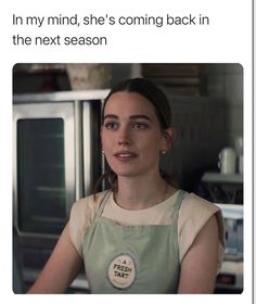 a woman in an apron is looking at the camera and she's coming back in the next season