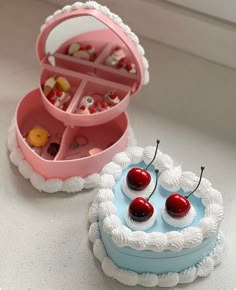 two small cakes with cherries in the shape of hearts