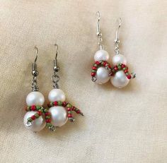 two pairs of white pearls and red beads on silver earwires, with green beading