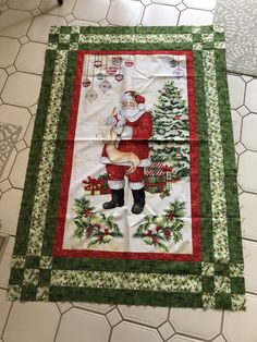 a quilted christmas table runner with santa claus