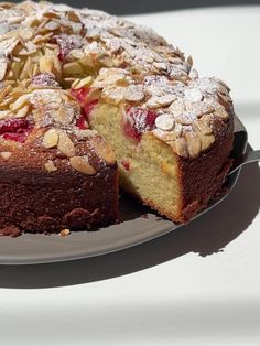 a cake that has been cut into pieces and is sitting on a plate