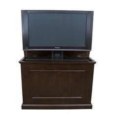 a flat screen tv sitting on top of a wooden cabinet