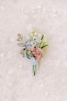 a bouquet of flowers laying on the ground