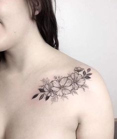 a woman with a flower tattoo on her chest