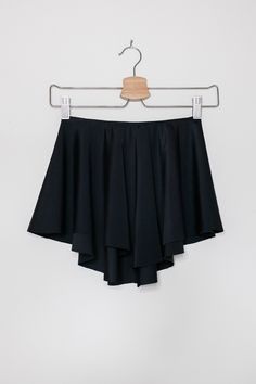 "Ready for that ballet class Our classic, black SAB style ballet skirt is exactly made for that! This ballet skirt is handmade with an added elastic waist band for a comfortable experience. Crafted 100% out of stretch nylon with a classic SAB design. This skirt sits comfortably around your hips making your legs look longer than they appear with a longer back for coverage and short sides. ✷ Perfect for Recital ✷ This black ballet dress is the perfect choice for a vintage/classy-style recital. A c Stretch Solid Pleated Swim Skirt, Stretch Solid Color Pleated Swim Skirt, Stretch Pleated Solid Color Swim Skirt, Ballet Stretch Skirt For Dance, Fitted Balletcore Dance Bottoms, Ballet Style Stretch Skirt For Dance, Summer Dance Mini Skort, Summer Mini Skort For Dance, Fitted Summer Bottoms In Balletcore Style