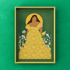 a paper cut out of a woman in a yellow dress with flowers around her neck