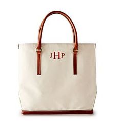 a white and brown tote bag with the letter jh in red on it