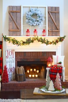 a living room decorated for christmas with candles and decorations