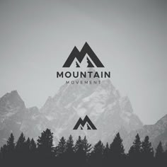 the mountain movement logo is shown in front of some pine trees and snow covered mountains