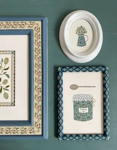 two framed pictures, one with a blue vase and the other with a green plant