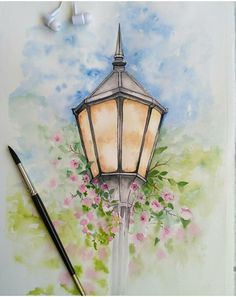 a watercolor painting of a street light with flowers on it and a paintbrush next to it