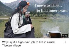 a woman sitting next to a pot on top of a grass covered field with mountains in the background