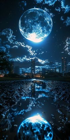 an image of a blue moon in the night sky over water with buildings and skyscrapers