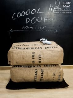 two bags sitting on top of each other in front of a blackboard