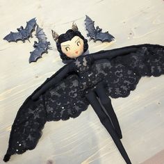 an image of a doll with bat wings