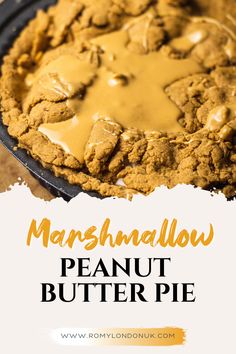 a close up of a pie in a pan with the words marshmallow peanut butter pie