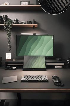 a desktop computer sitting on top of a wooden desk next to a keyboard and mouse