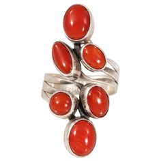 Navajo coral and sterling silver ring marked "Nakai Sterling." Six nuggets of beautiful coral in semi twist sterling wrap band. PERIOD: After 1950 ORIGIN: Navajo, Southwest SIZE: Size 7, 1.5"L Rings, Coral, Sterling Silver, Navajo, Rings, Native American Jewelry Family Owned & Operated Cisco’s Gallery deals in the rare, exceptional, and one-of-a-kind pieces that define the history of America and the Old West. Our pieces range from American Indian to Cowboy Western and include original items of e Navajo Rings, Coral Gemstone, Coral Ring, Native Jewelry, Coral Jewelry, Silver Christmas, Cow Boy, American Jewelry, Beaded Rings