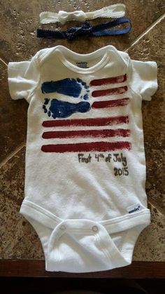 a baby's bodysuit and headband with the american flag painted on it