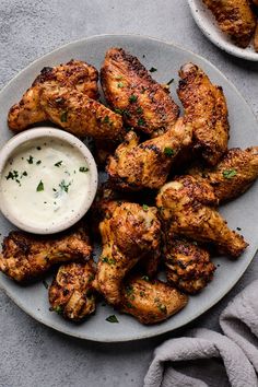 chicken wings with ranch dressing on a plate