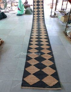 a long black and white rug on the floor