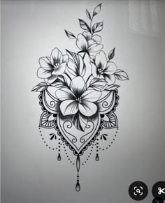 a black and white drawing of flowers on a wall