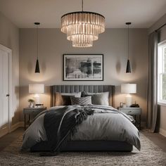 a large bed sitting under a chandelier next to two lamps on either side of a window