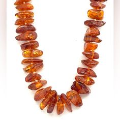 This Beautiful Necklace Is Made Of Genuine Vintage Amber, With A Beaded Style And A Length Of 22.75 Inches. The Orange Color Of The Amber Nuggets Adds A Warm And Unique Touch To Any Outfit. The Beads Are Graded With The Larger Amber Nuggets In The Center. Perfect For Both Men And Women, This Necklace Is A Rare Find For Vintage Jewelry Collectors. The Main Stone, An Amber Nugget, Is Carefully Selected To Ensure Its Quality And Authenticity. Make A Statement With This Stunning Piece Of Jewelry, Perfect For Any Occasion. Original Price $850. Cat. 2902 Amber Bead Necklace, Orange Necklace, Amber Ring, Amber Necklace, Amber Beads, Amber Jewelry, Beautiful Necklace, Beautiful Necklaces, Womens Jewelry Necklace