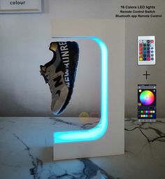 an image of a pair of sneakers in the shape of a light up letter on a marble countertop