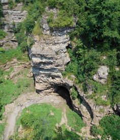 an aerial view of a rock formation in the woods