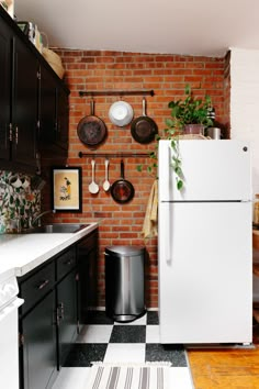 a white refrigerator freezer sitting inside of a kitchen