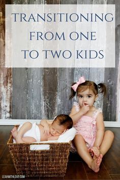 two babies sitting in a basket with the words transitioning from one to two kids