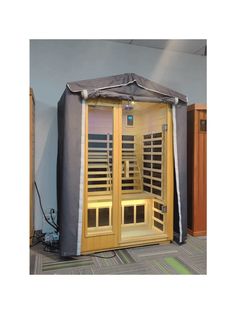 an indoor sauna is shown with the door open