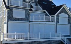 a large house with white balconies and windows