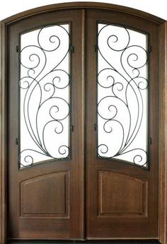 an image of a wooden door with wrought iron designs on the glass and side panels