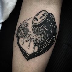 a black and white photo of a tattoo on the arm