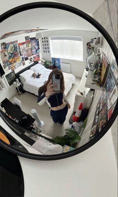 a woman is taking a selfie in the mirror