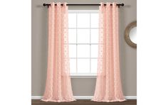 a window with pink sheer curtains in front of it