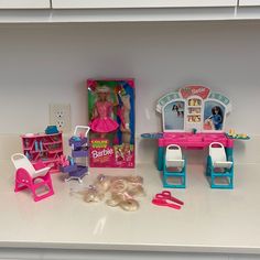 the barbie doll house is set up with all its furniture and accessories, including chairs