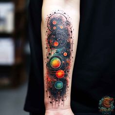 a person with a tattoo on their arm that has an image of circles and stars