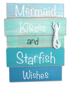 a wooden sign that says mermaid kisses and starfish wishes